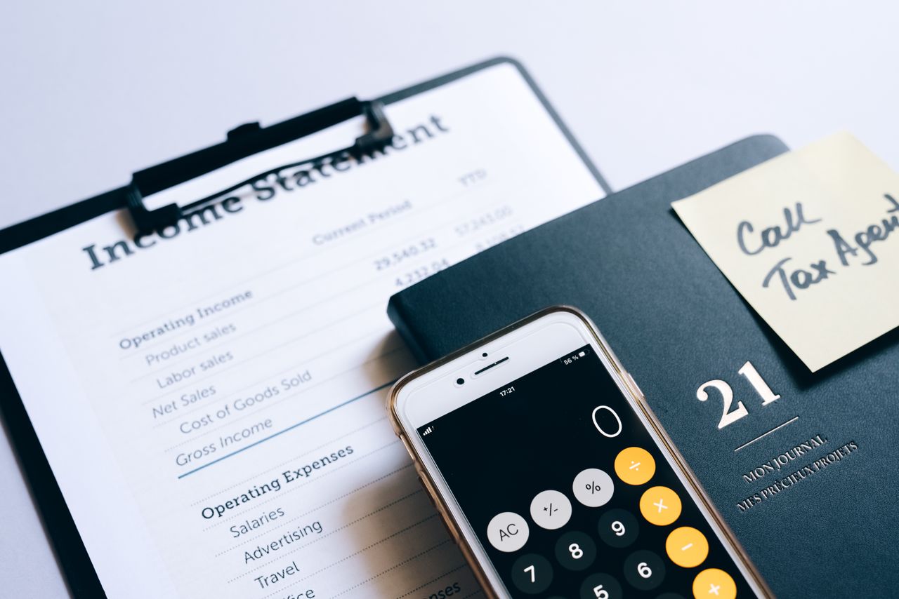 services-02 Close-up of income statement, calculator, and planner for financial planning.